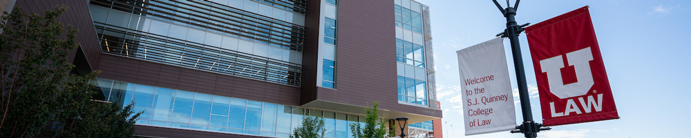 lightpole banners in front of the S.J. Quinney law building