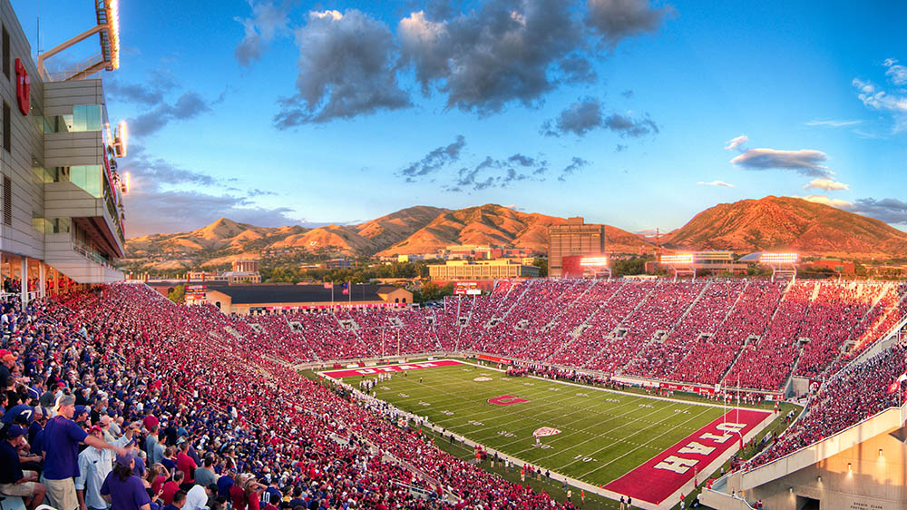 The University of Utah's Rice Eccles Stadium, filled with fans wearing red and cheering on the U's football team