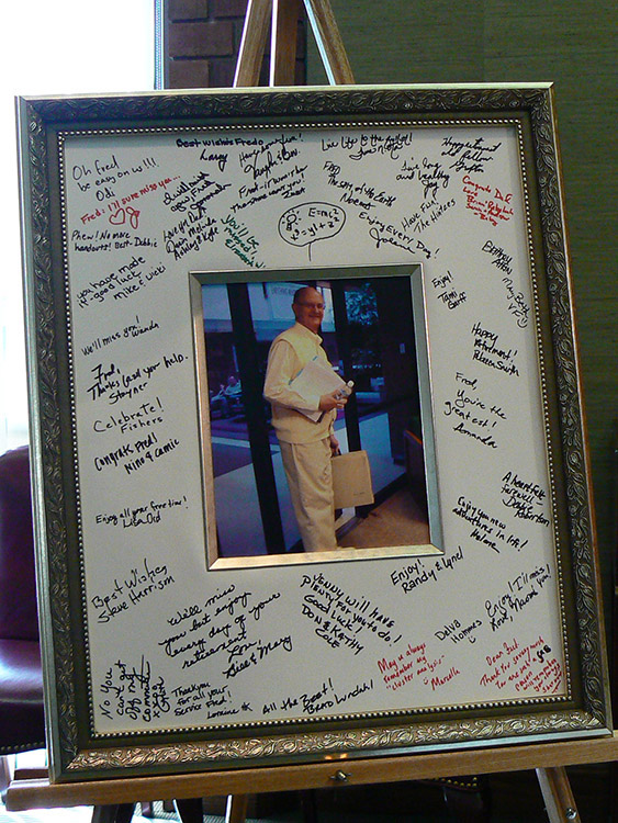 A framed photo of Dr. Fred Janzen with notes written around the picture