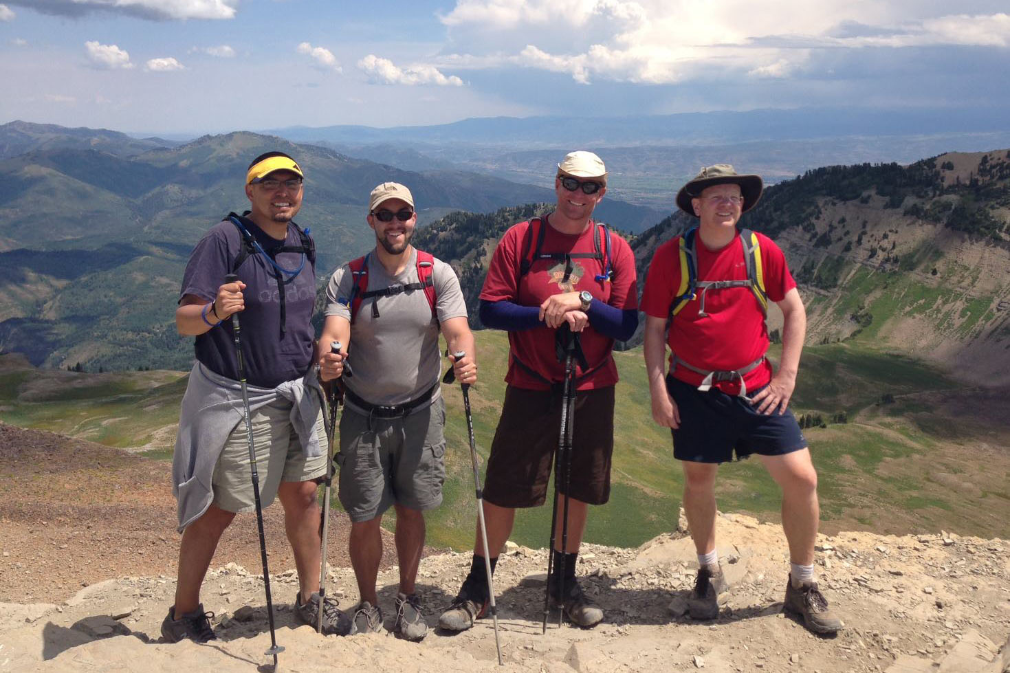 Photo of Dr. Jason Castillo, Dr. Eric Garland, Dr. Rob Butters, and Dr. Brad Lundahl summiting Mount Timpanogos