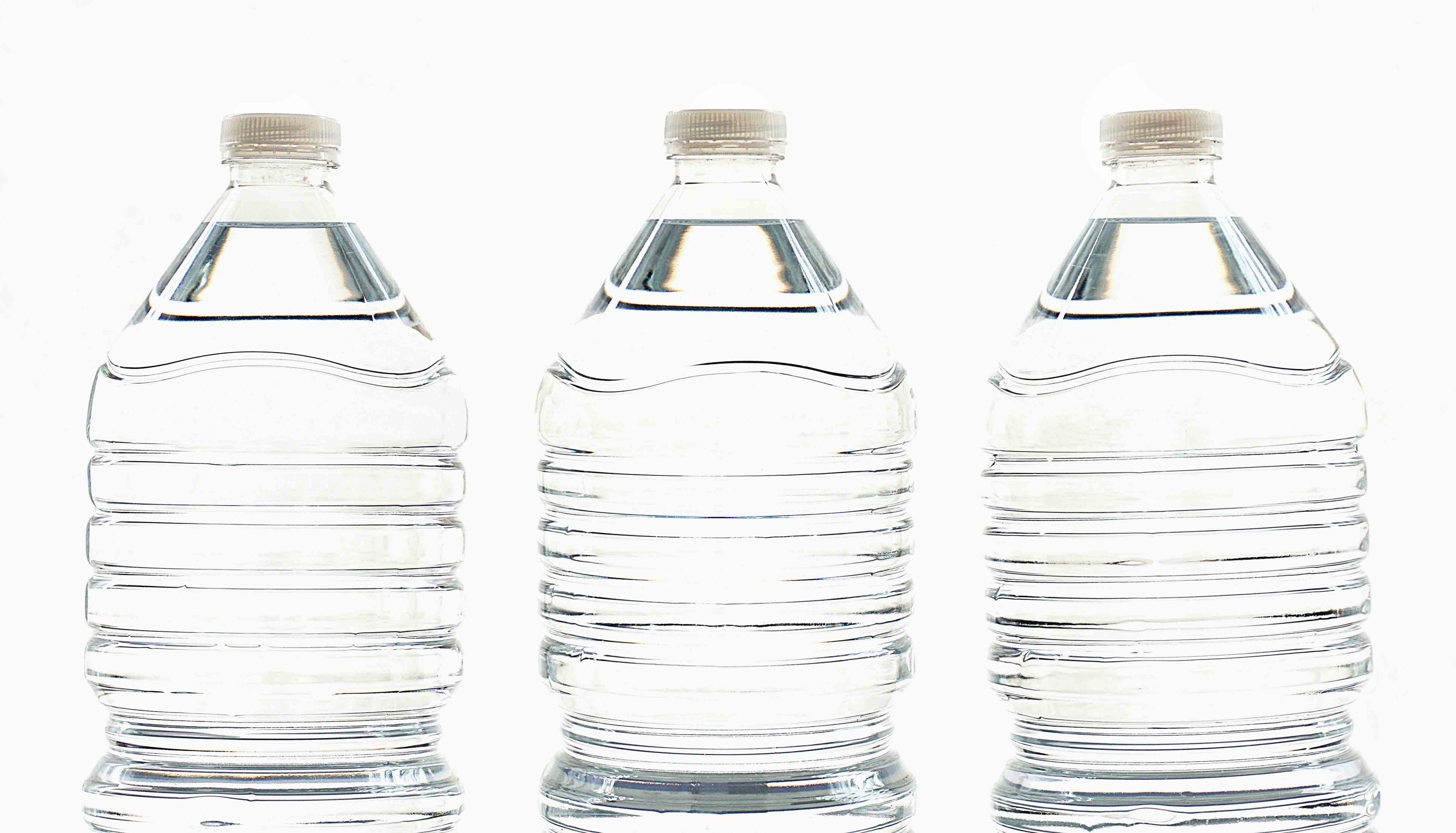 a photo of three clear plastic water bottles