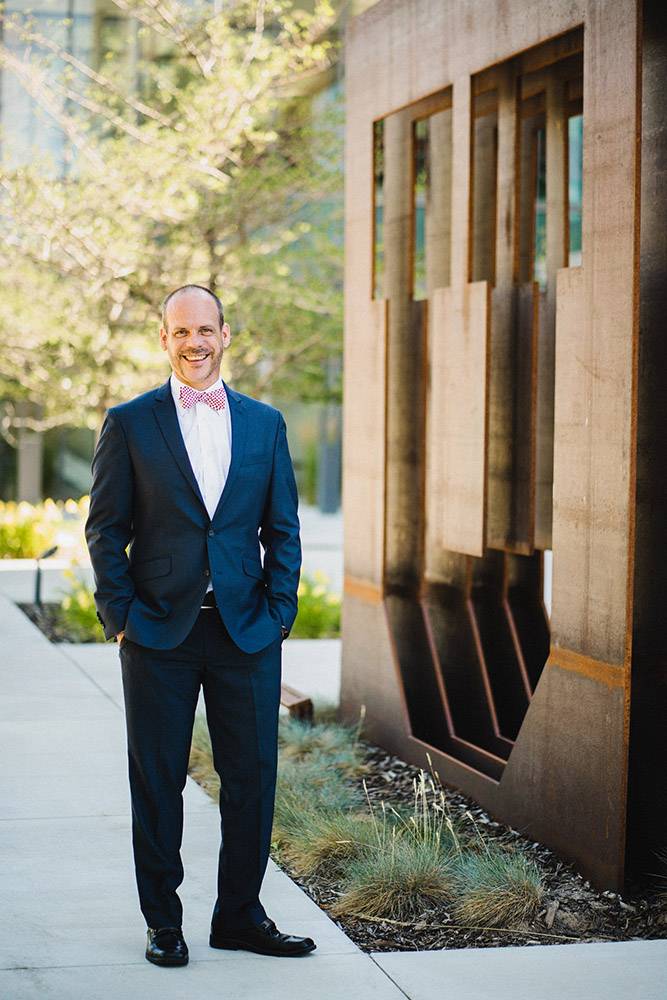 Dean Osteen standing next to a building